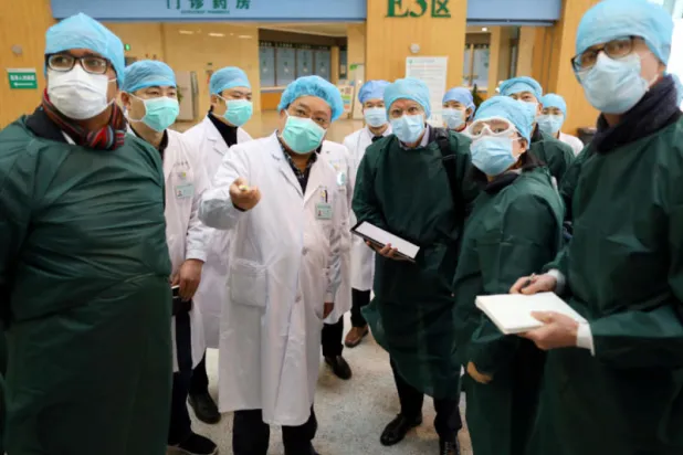 زيارة خبراء منظمة الصحة العالمية إلى الصين في مارس 2021 (رويترز)