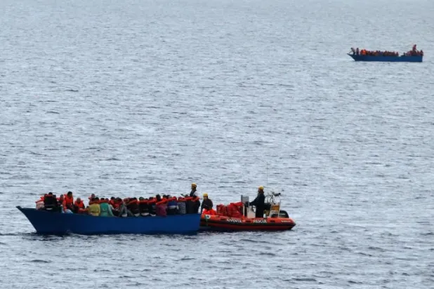 Migrants on a wooden boat are rescued by German NGO Jugend Rettet ship "Juventa" crew in the Mediterranean sea off Libya coast, June 18, 2017. Picture taken on June 18, 2017. REUTERS/Stefano Rellandini




