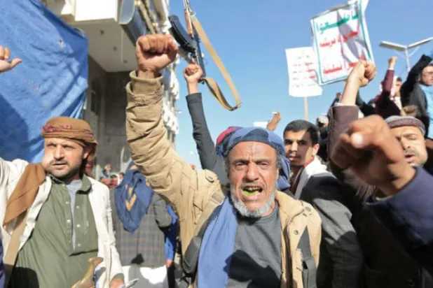 Houthi militants in Sanaa chanting the group’s slogans (AFP)
