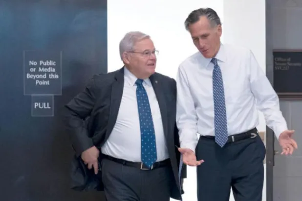 Senate Foreign Relations Chairman Robert Menendez, D-N.J., left, and Sen. Mitt Romney, R-Utah, depart after a closed briefing on the unknown aerial objects the US military shot down at the Capitol in Washington, Tuesday, Feb. 14, 2023. AP