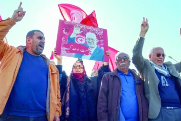 A demonstration by Ennahdha supporters after the leader of the movement, Rached Ghannouchi, was summoned for interrogation. Reuters file photo