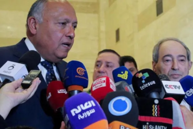 شكري والمقداد خلال مؤتمرهما الصحافي في دمشق (رويترز)