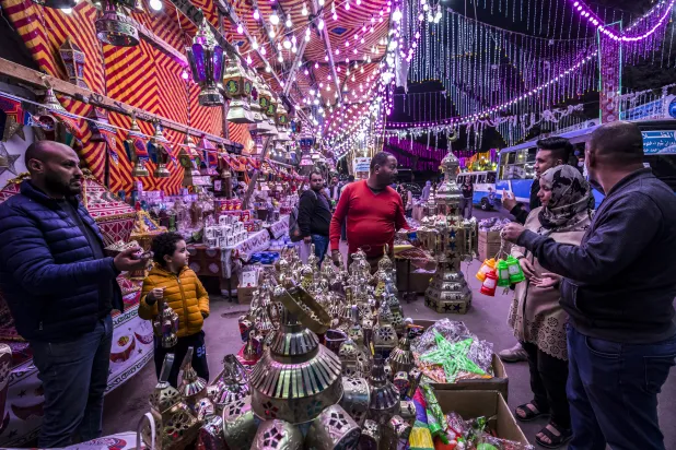  People shop from a stall selling Ramadan lanterns along a main
street in the northern suburb of Shubra of Egypt's capital Cairo at
the start of the Ramadan. [Khaled Desouki/AFP]
