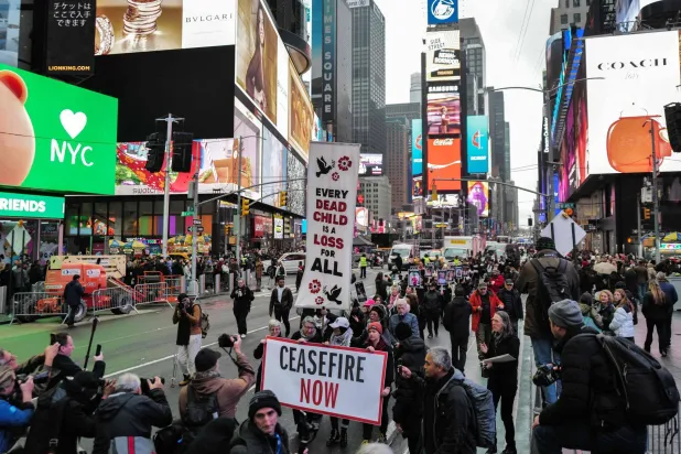 Protesters commemorate the children killed in Gaza during a demonstration in New York City on December 28 (AFP)