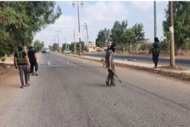 عناصر من فصائل التسويات في بلدة اليادودة (تجمع أحرار حوران)