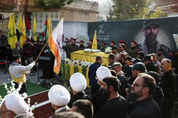 Mourners attend the funeral of Wissam Tawil, a commander of Hezbollah’s Radwan forces who according to Lebanese security sources was killed during an Israeli strike on south Lebanon, in Khirbet Silem, Lebanon, January 9, 2024. (Reuters) 