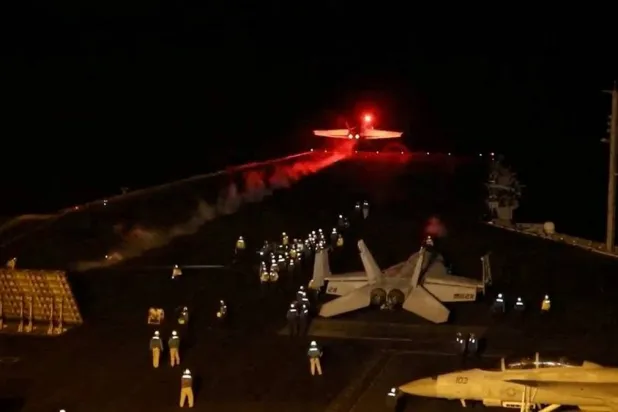 An aircraft takes off to join the US-led coalition to conduct air strikes against military targets in Yemen, aimed at the Iran-backed Houthi militias that have been targeting international shipping in the Red Sea, from an undisclosed location, in this handout picture released on January 12, 2024. (US Central Command via X/Handout via Reuters) 