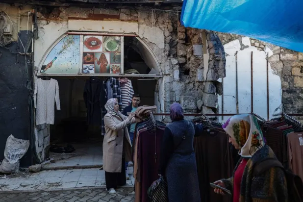 People shop at the bazaar. (EPA)