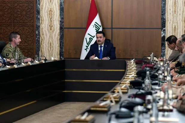 Iraqi Prime Minister Mohammed Shia al-Sudani chairs a meeting with top-ranking officials of the Iraqi armed forces and of the US-led coalition during the first round of talks on the future of American and other foreign troops in the country, in Baghdad on January 27, 2024. (AFP)