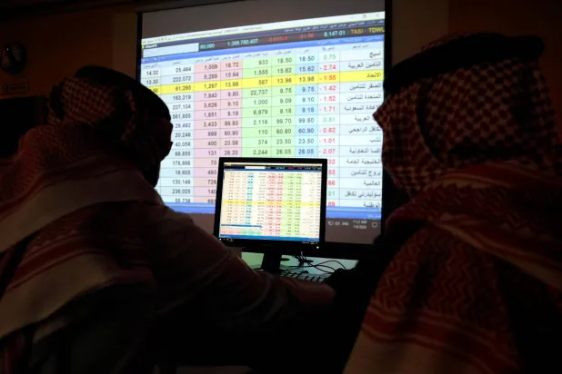 Saudi trader monitors stocks at the Saudi stock market in Riyadh (Reuters)