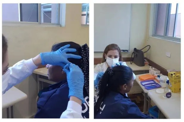 سيدة تخضع لجلسة بالإبر في الأذن (جامعة ساو باولو)