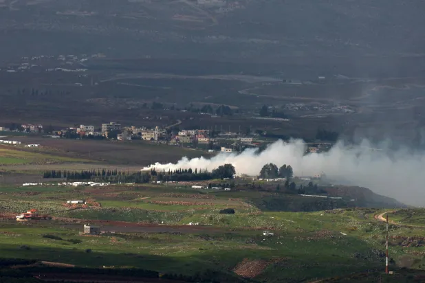 Smoke rises from the village of Arab El Louaizeh southern Lebanon following Israeli shelling, as seen from the Israeli side of the border, 03 March 2024. EPA/ATEF SAFADI