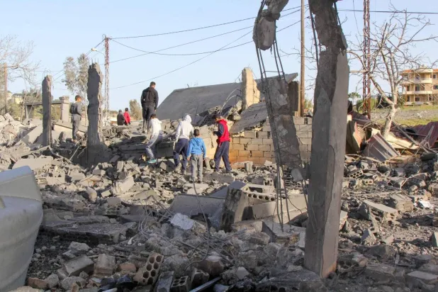 Lebanese citizens Inspect Destroyed Building After Israeli Airstrike in Southern Town of Dibbin (AFP)