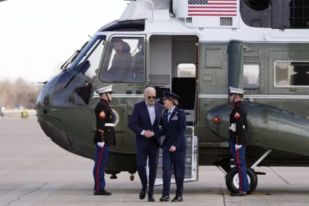 President Joe Biden, escorted by Col. Angela Ochoa, commander of the 89th Airlift Wing, arrives to board Air Force One at Andrews Air Force Base, Md., Tuesday March 19, 2024, en route to Nevada. (AP)