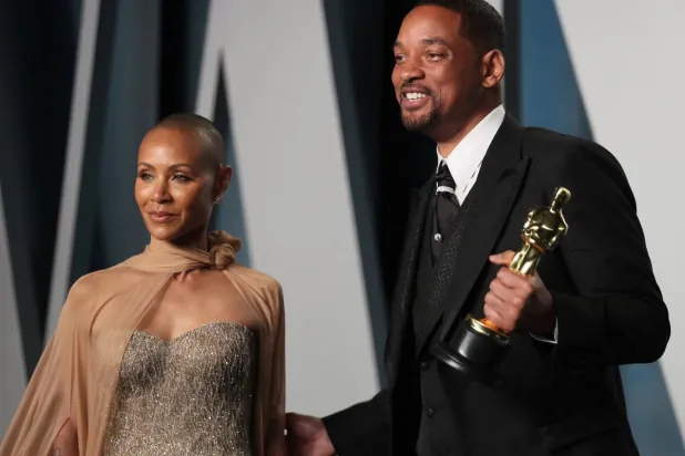 الممثل الشهير ويل سميث وزوجته جادا (رويترز)