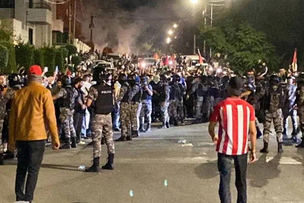 Protesters clash with security forces in front of the Israeli embassy in Amman in October 2023. (AFP) 