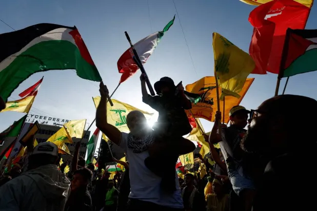 Hezbollah supporters attend a ceremony in Beirut’s southern suburbs honoring members killed in clashes with Israel. (Reuters) 