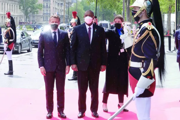 French President Emmanuel Macron welcomes the President of the Sudanese Sovereignty Council, Abdel Fattah Al-Burhan, during the Paris conference, May 17, 2021 (AFP)