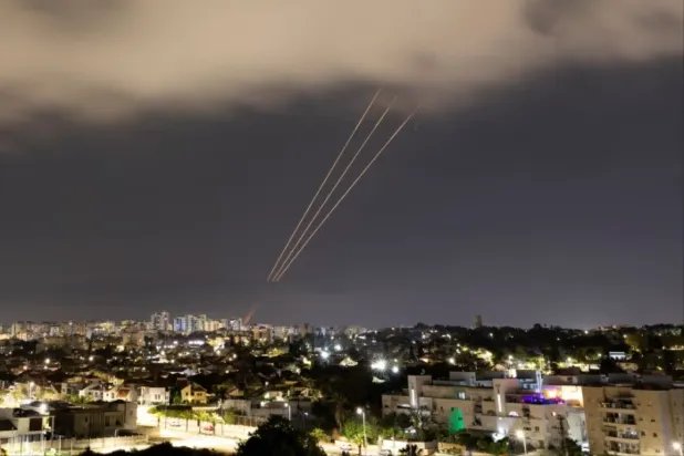Israeli defenses intercept Iranian drones and missiles. (Reuters) 