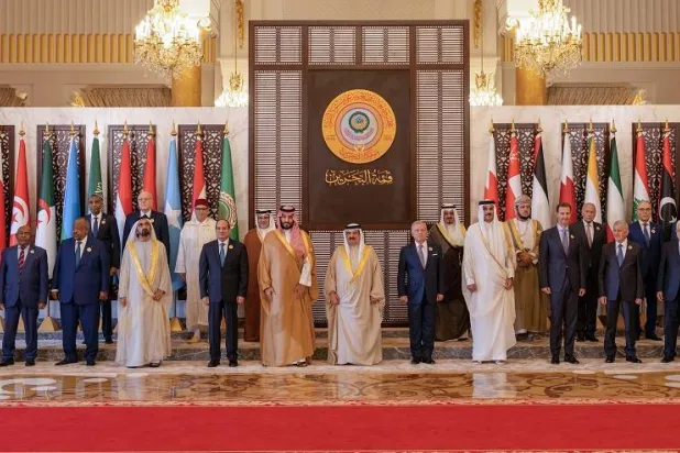 A handout photo made available by the official Bahrain News Agency (BNA) shows Bahrain's King Hamad bin Isa al-Khalifa (C) posing for family photo with Arab leaders and participants at the 33rd Arab League Summit, in Manama, Bahrain, 16 May 2024. (EPA/BNA) 