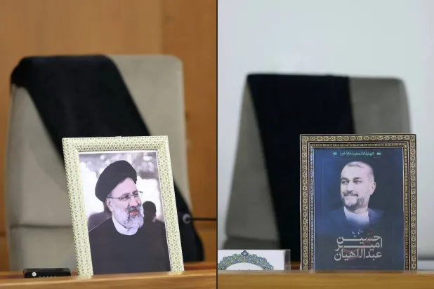 صورتا الرئيس الإيراني إبراهيم رئيسي ووزير خارجيته حسين أمير عبداللهيان على كرسيين فارغين خلال اجتماع الحكومة في طهران (الرئاسة الإيرانية - أ.ف.ب)