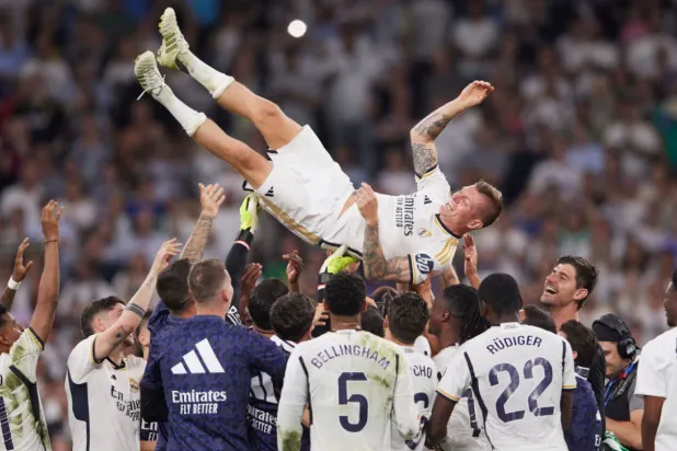 Toni Kroos is thrown in the air by Real Madrid teammates last Saturday to mark his final game at the Bernabéu. Photograph: Manu Reino/DeFodi Images/Shutterstock
