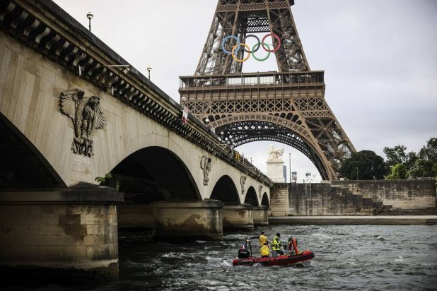 A rescue boat cruises on the Seine river near the Eiffel Tower during a rehearsal for the Paris 2024 Olympic Games opening ceremony, Monday, June. 17, 2024 in Paris. (AP)