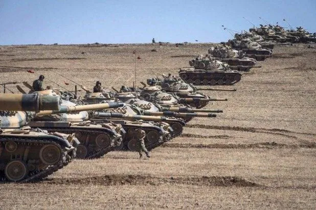 Turkish tanks are seen in areas adjacent to regions held by the Kurdish Syrian Democratic Forces (SDF) in northern Syria. (Turkish Defense Ministry file) 