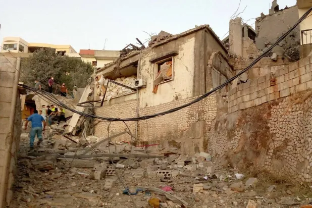 A Lebanese inspects homes destroyed by Israeli airstrikes in the town of Khiam in southern Lebanon (AFP)