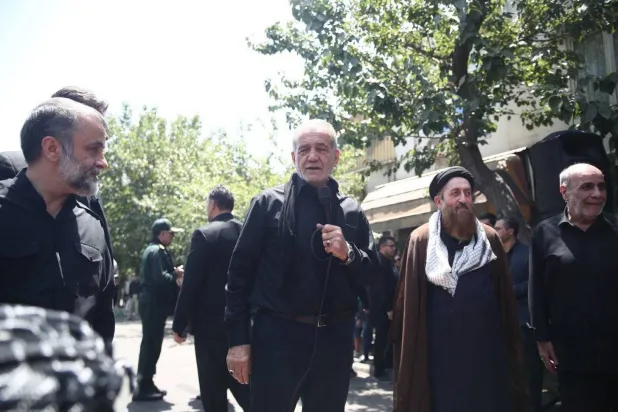 A photo posted online showing Iranian President-elect Masoud Pezeshkian attending a religious procession for Ashura on Jomhouri Street in central Tehran 
