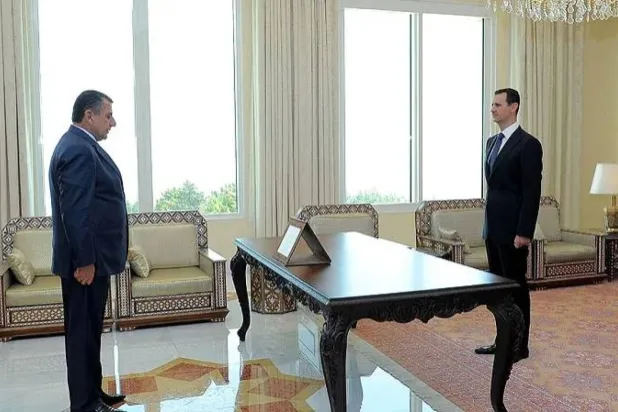 Eski Suriyeli yetkili Samir eş-Şeyh, Suriye Devlet Başkanı Beşşar Esed ile daha önce yaptığı bir görüşme sırasında (SGG)