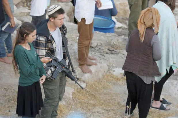 مستوطنون مسلّحون في الضفة الغربية (أرشيفية - وفا)