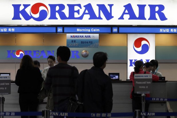 FILE - Passengers approach a Korean Air counter at Gimpo airport in Seoul, South Korea, Oct. 25, 2012. (AP Photo/Lee Jin-man, File)