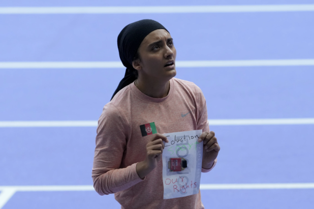 Kimia Yousofi after finishing last in her 100-meter preliminary heat - The AP