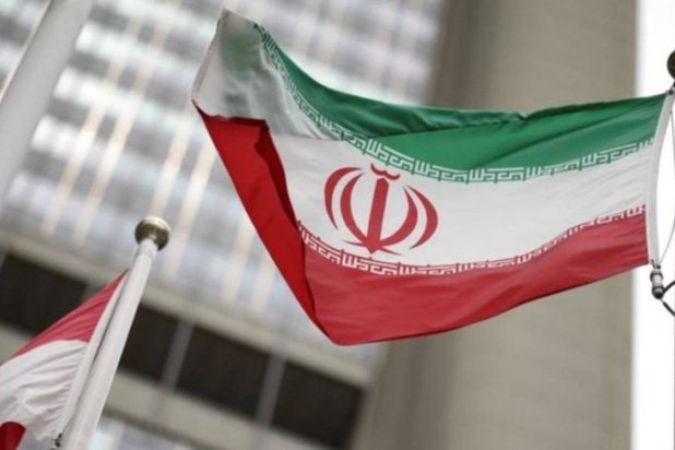 An Iranian flag flies in front of the UN office building, housing IAEA headquarters, amid the coronavirus disease (COVID-19) pandemic, in Vienna, Austria, May 24, 2021. (Reuters)
