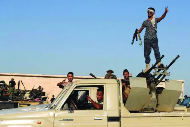 عناصر تشكيلات مسلّحة في طرابلس (الشرق الأوسط)