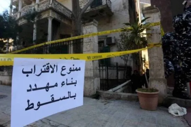 A sign warns against approaching a building at risk of collapse in Lebanon. (file photo) 
