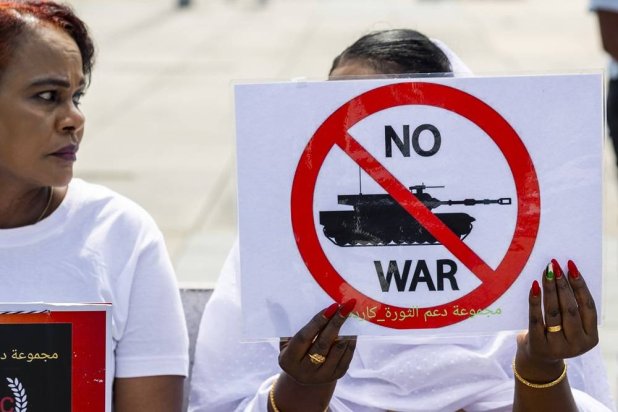 Women take part in a demonstration on the opening day of talks aimed at a cessation of hostilities in Sudan on Place des Nations in front of the European headquarters of the United Nations, in Geneva, Switzerland, 14 August 2024. (EPA)