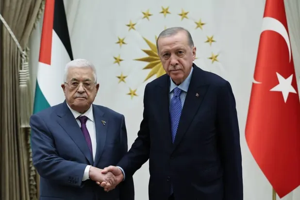 A handout photo made available by the Turkish Presidential press office shows Turkish President Recep Tayyip Erdogan (R) shaking hands with Palestinian President Mahmoud Abbas (L) in Ankara, Türkiye, 14 August 2024. (EPA/ Turkish Presidential press office) 