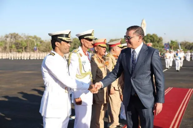 Head of Libya’s Government of National Unity Abdulhamid al-Dbeibah is seen with Abdulrahman Milad, also known as “Al-Bidja,” the Commander of the Naval Academy. (File photo)