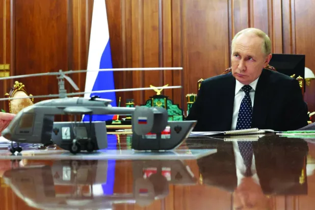 Rusya Devlet Başkanı Vladimir Putin dün Kremlin'de bir toplantıda (AFP)