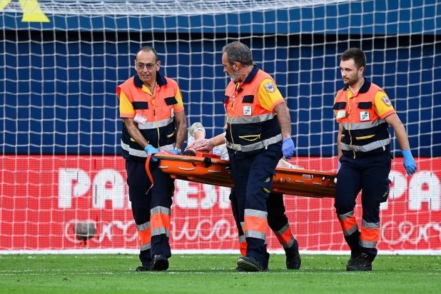 Barcelona's German goalkeeper #01 Marc-Andre ter Stegen is escorted off-pitch on a stretcher during the Spanish league football match between Villarreal CF and FC Barcelona at La Ceramica stadium in Vila-real, on September 22, 2024. (AFP)