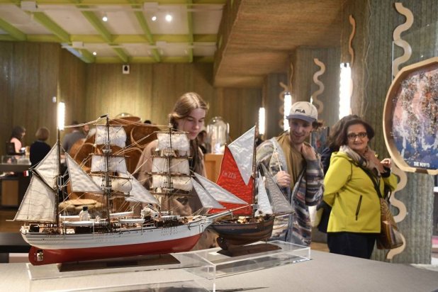 Visitors attend an exhibition of model ships made by the Madagascar company Le Village and on display at the Homo Faber 2024 show in Venice, Italy, Friday, Sept. 13, 2024.(AP) 