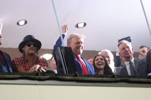 Republican presidential candidate, former US President Donald Trump, watches the Alabama Crimson Tide versus Georgia Bulldogs college football game with musician Kid Rock and Sen. Tommy Tuberville (R-AL) at Bryant-Denny Stadium on September 28, 2024 in Tuscaloosa, Alabama. (Getty Images via AFP) 