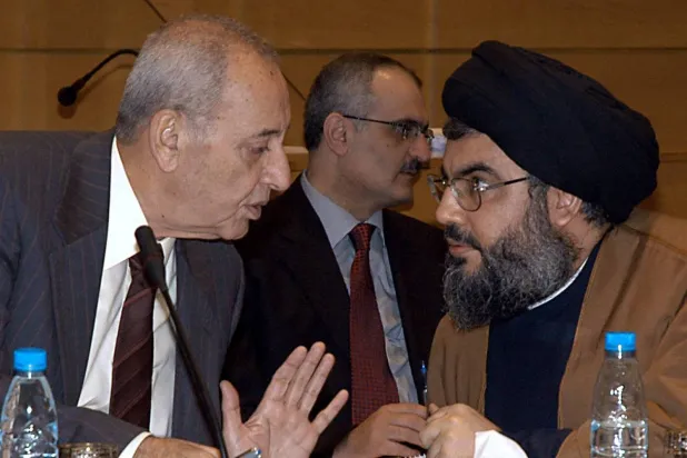 Parliament Speaker Nabih Berri and slain Hezbollah leader Hassan Nasrallah during a dialogue meeting in 2006. (AFP) 