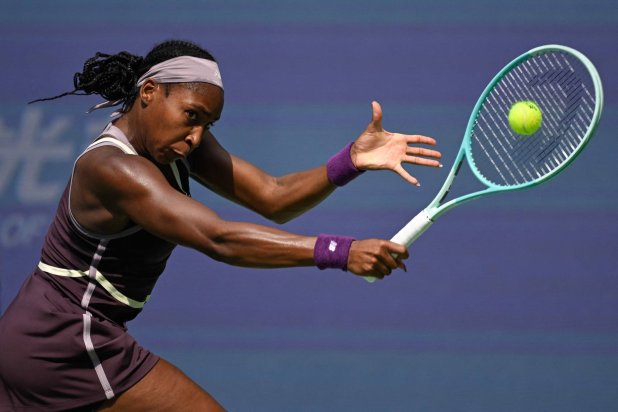 Coco Gauff of the USA hits a return to Ukraine's Marta Kostyuk during their women's singles match at the Wuhan Open tennis tournament in Wuhan, China's Hubei province on October 10, 2024. (Photo by WANG Zhao / AFP)