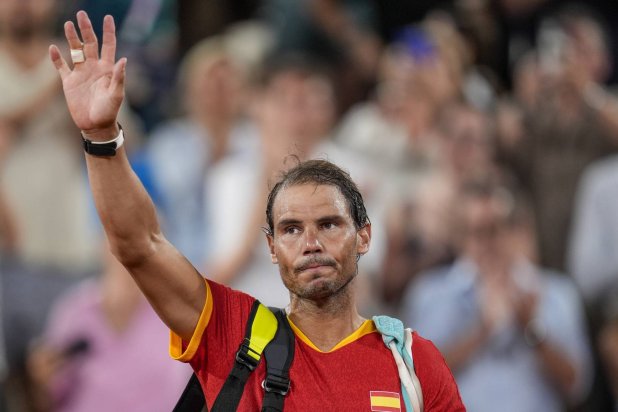 FILE - Rafael Nadal reacts waves after the men's doubles quarter-final tennis competition at the Roland Garros stadium, at the 2024 Summer Olympics, July 31, 2024, in Paris, France. (AP Photo/Manu Fernandez, file)
