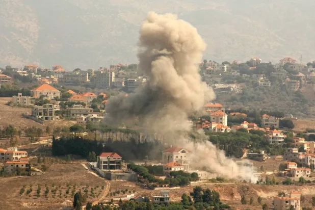 Smoke rises from the site of an Israeli airstrike that targeted the southern Lebanese village of al-Khiam on October 13, 2024. (AFP) 