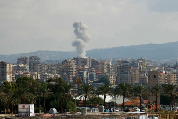  A picture taken from the southern Lebanese city of Tyre shows smoke rising from the site of an Israeli strike targeting the village of Qana on October 12, 2024. (AFP) 