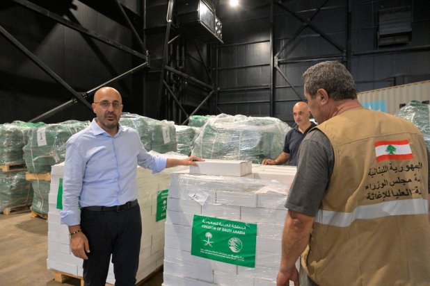 Lebanon’s Environment Minister Nasser Yassin, Coordinator of the National Disaster and Crisis Response Committee, oversees the delivery of aid at the “High Relief Commission” warehouse in Lebanon (Asharq Al-Awsat)